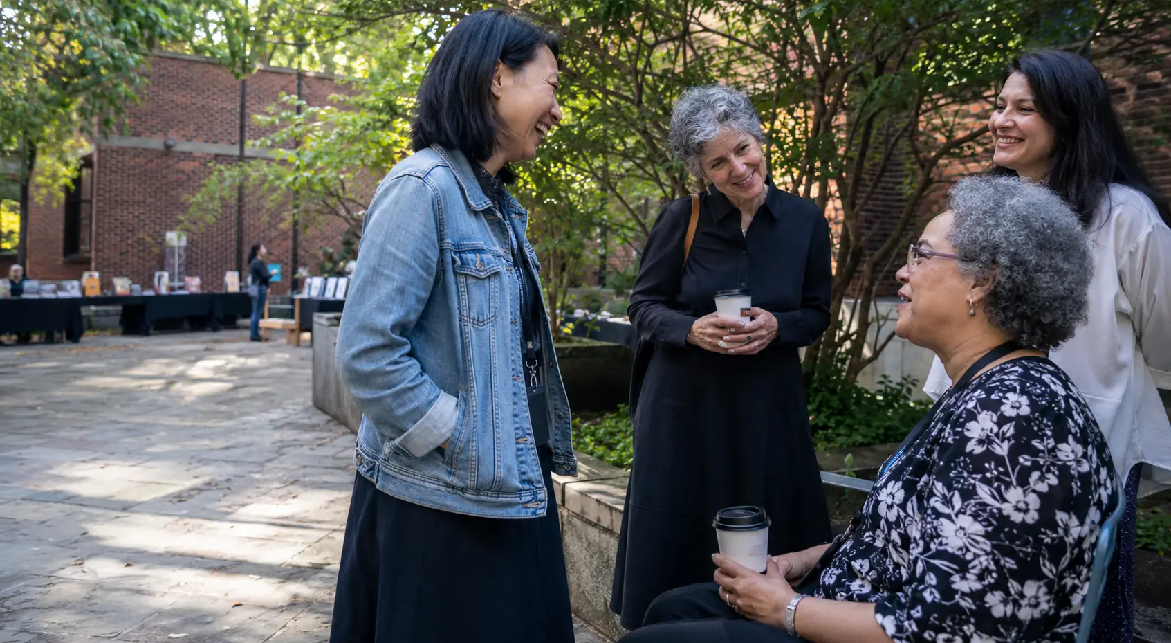 Librarians exchanging ideas during an outdoor coffee break