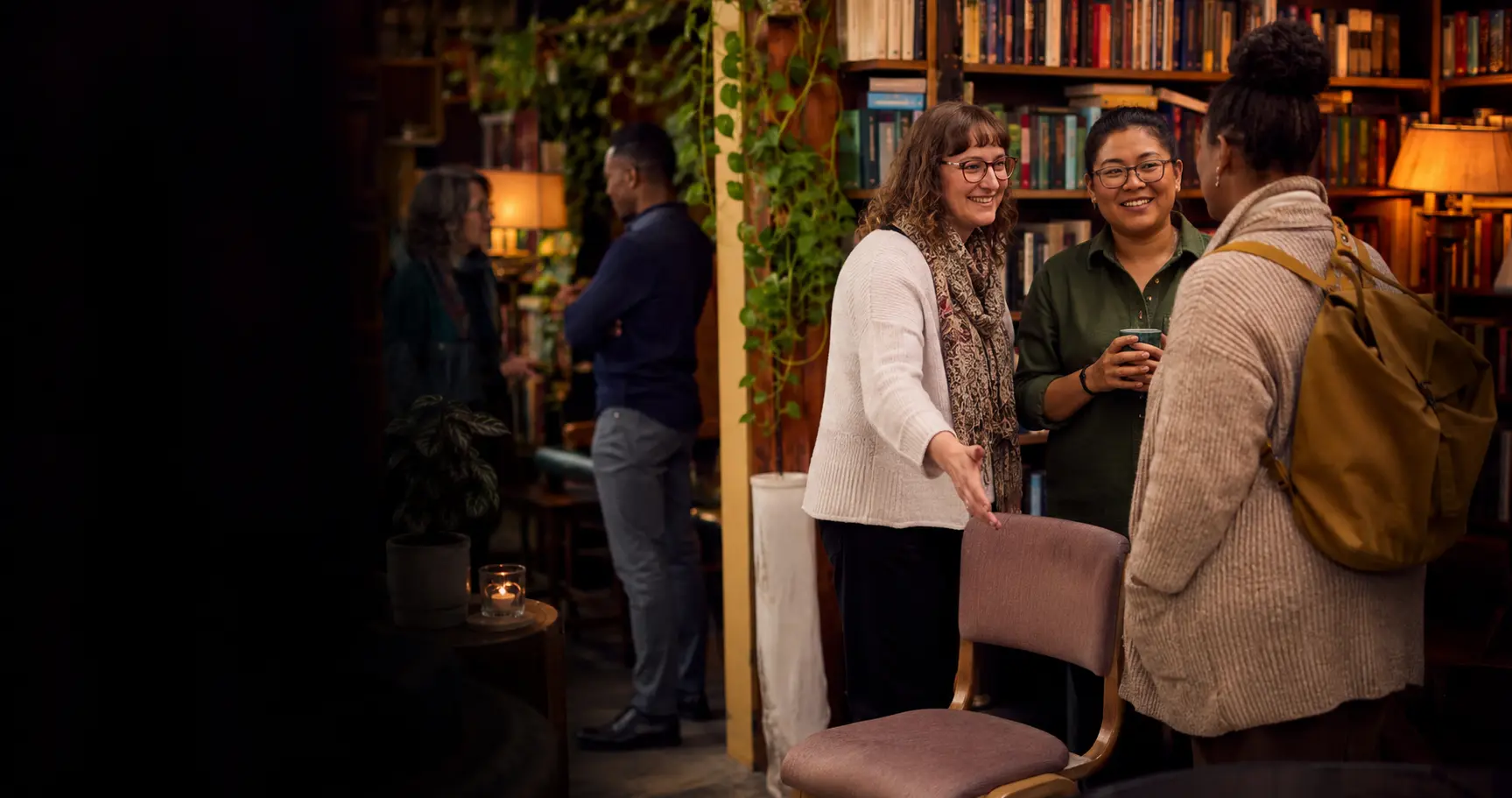 Librarians welcoming a new colleague at a community gathering
