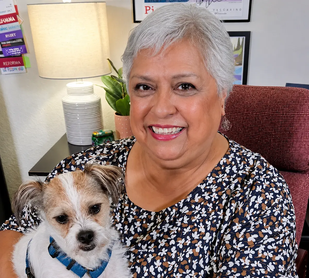 Patty Ramirez smiling with her puppy, Pistol Pete